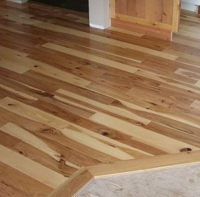 A close up of a wooden floor in a room.