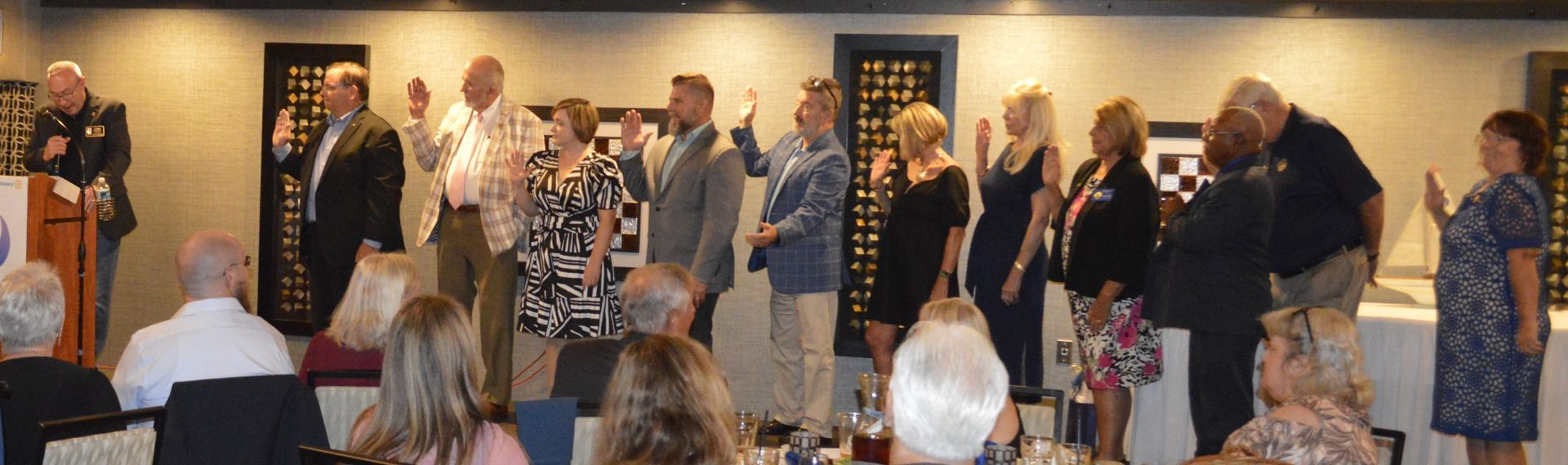 A group of people are dancing in a room at a party.