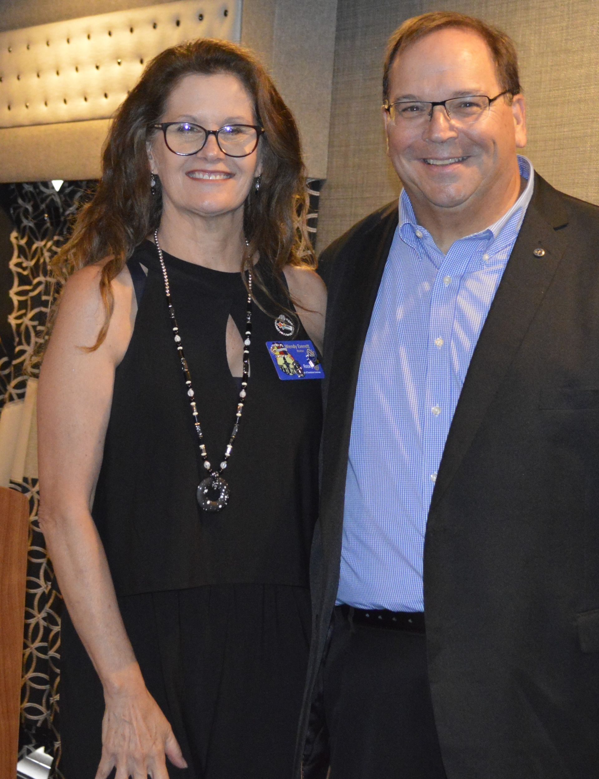 A man and a woman are posing for a picture together