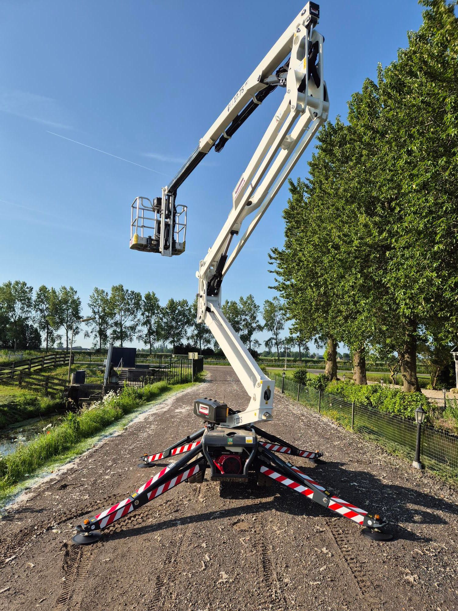 A concrete pump is being used to pump water into a river.