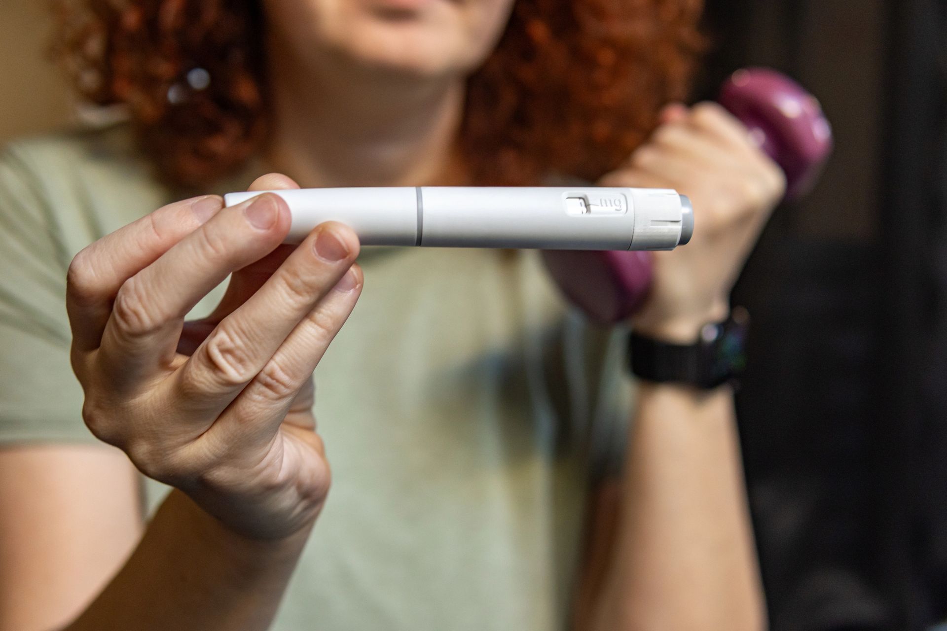 Person holding a white pregnancy test with a visible result line