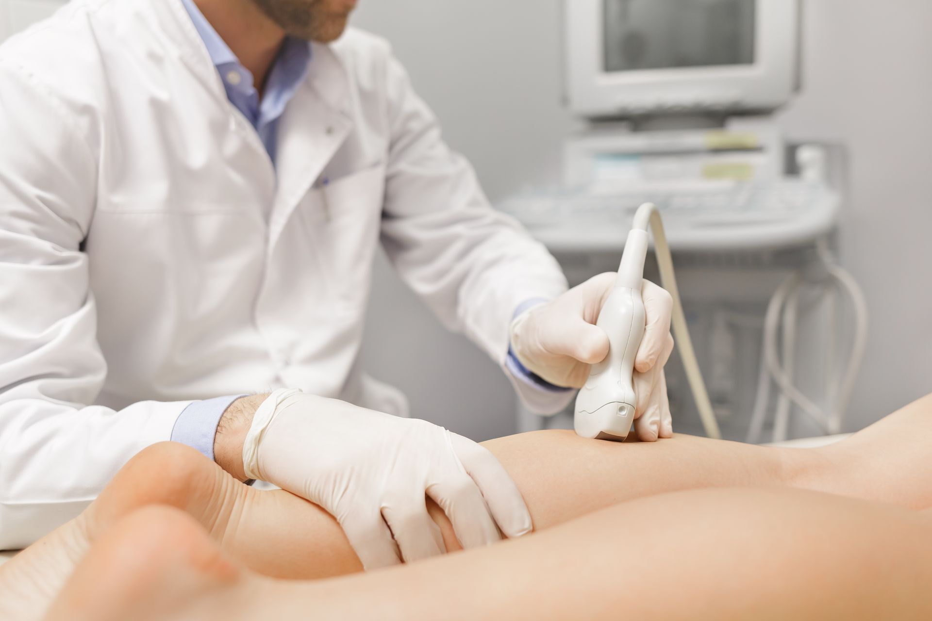 vein doctor examining a patient's leg