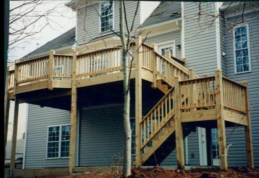 A house with a wooden deck and stairs