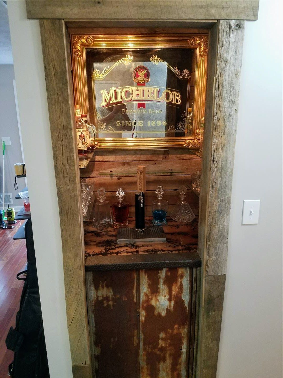 A doorway with a mirror and a sign that says michiels on it.