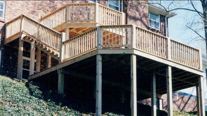A wooden deck with stairs leading up to it