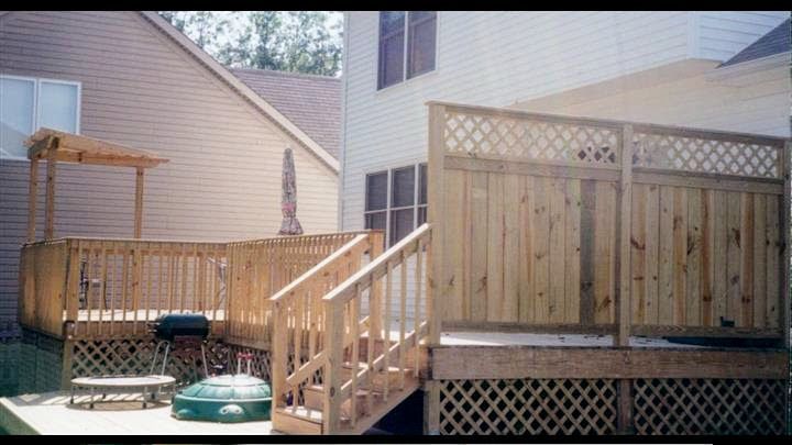 A wooden deck with stairs leading up to it