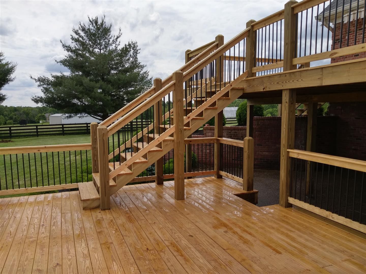 A wooden deck with stairs leading up to it