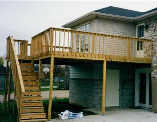 A house with a wooden deck and stairs