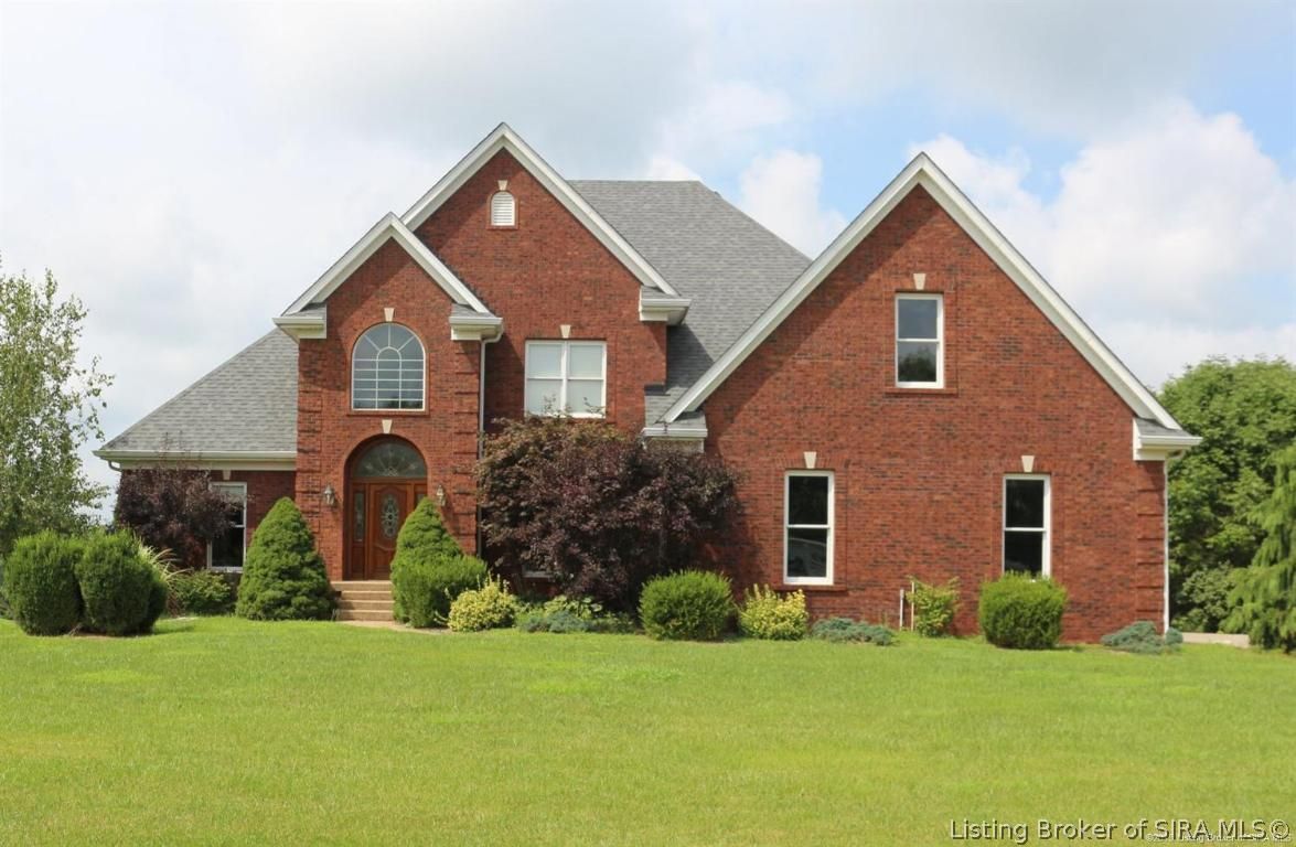 A large red brick house with a gray roof