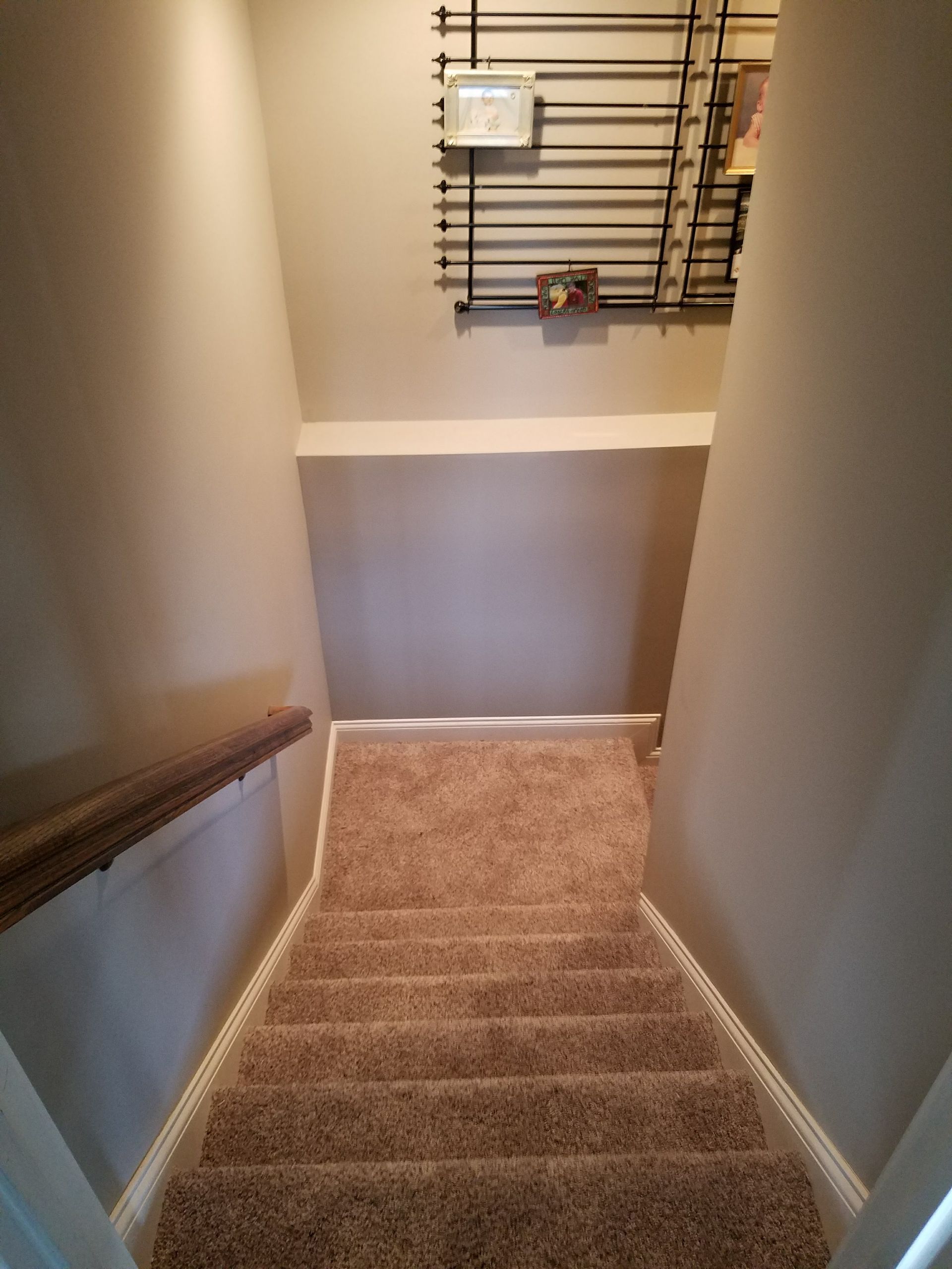 A set of stairs leading up to the second floor of a house.