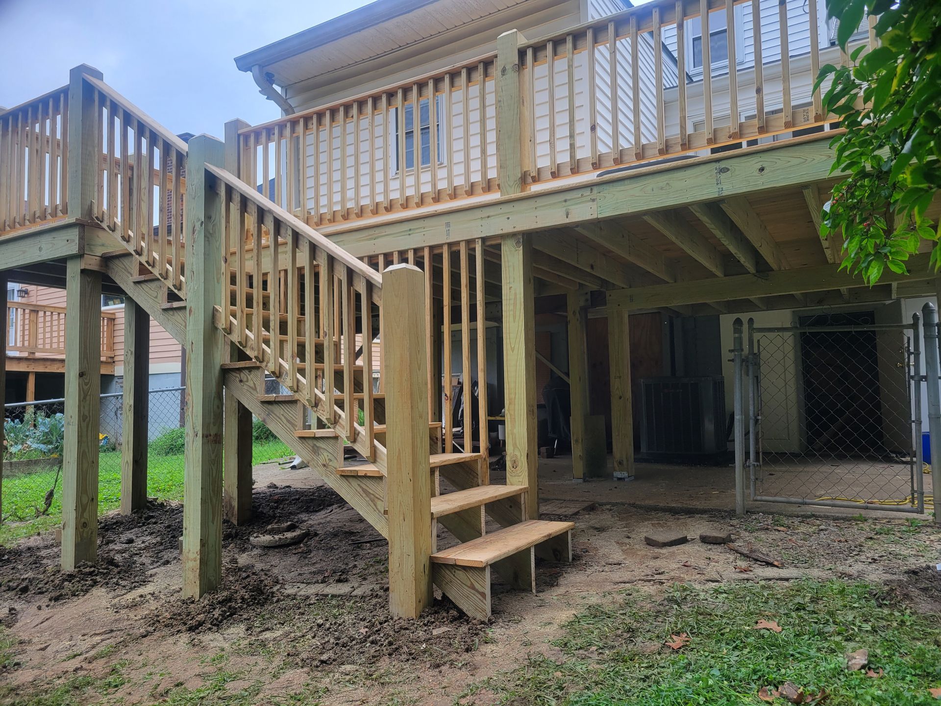 A wooden deck with stairs leading up to it