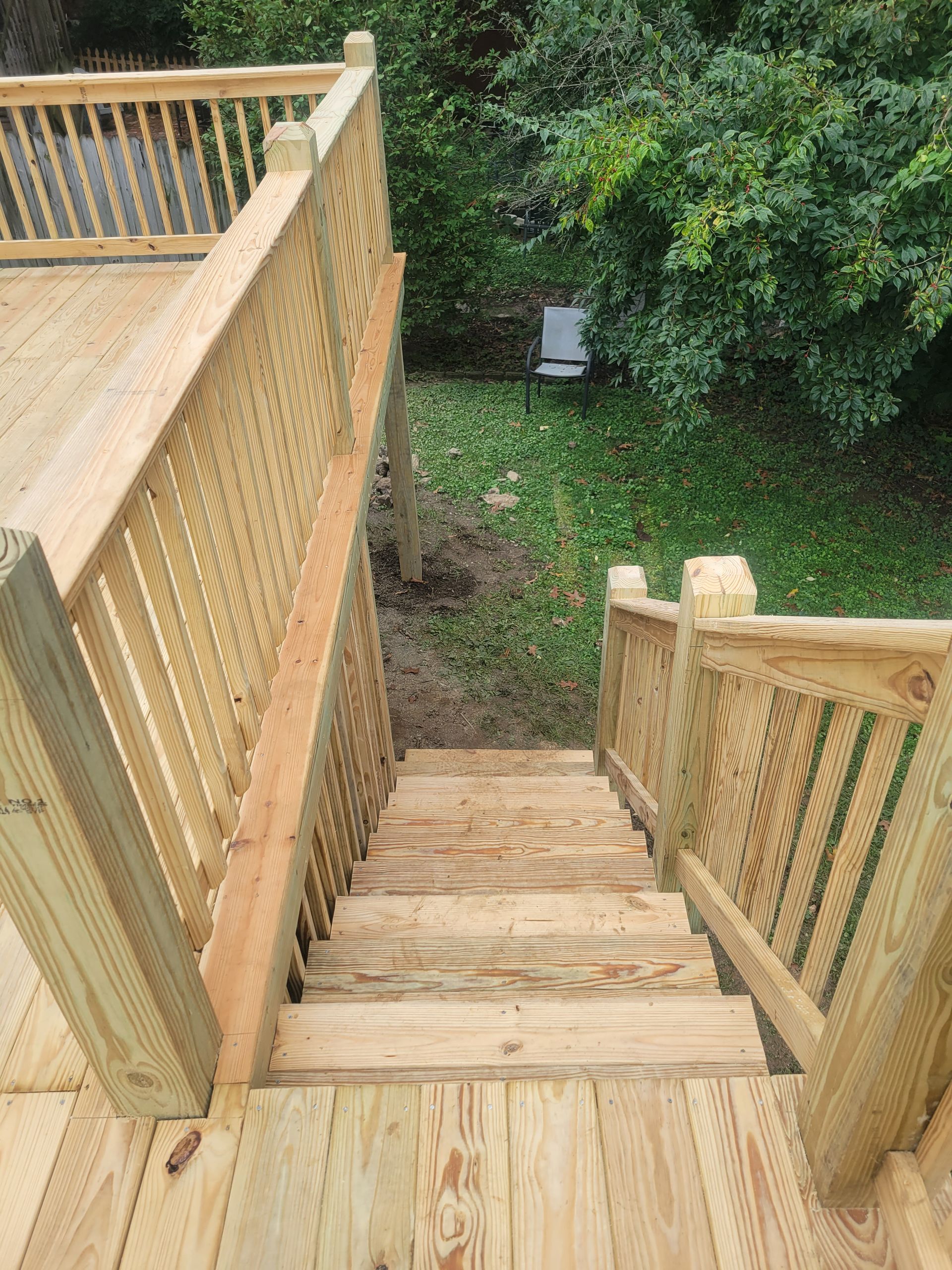 A wooden deck with stairs leading up to it.