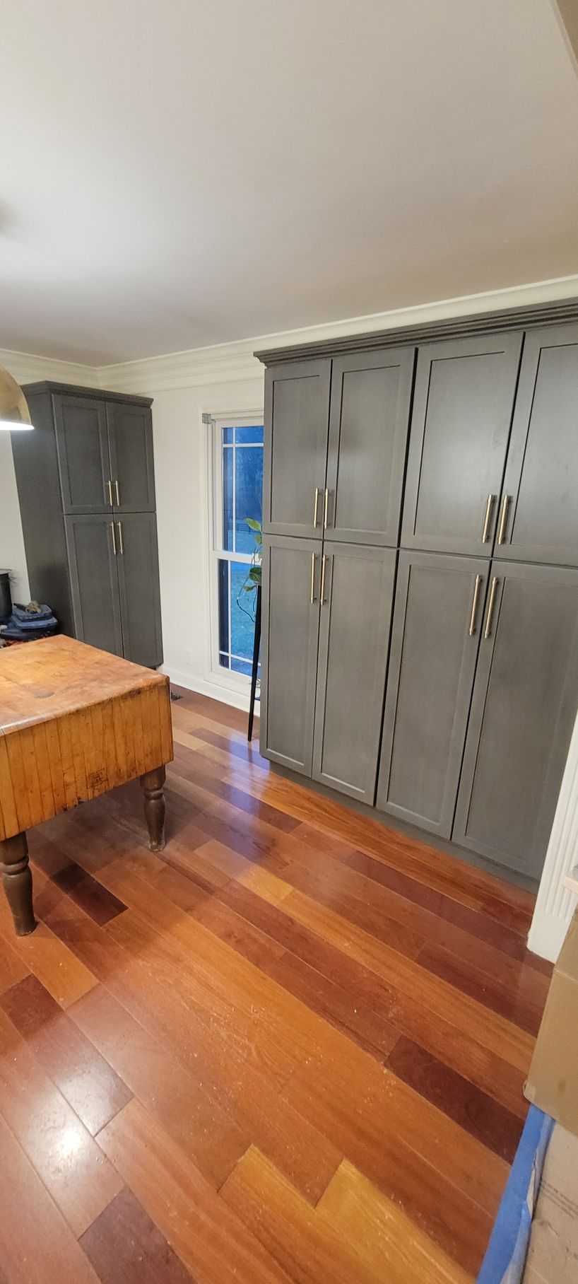 There is a pool table in the middle of the room.