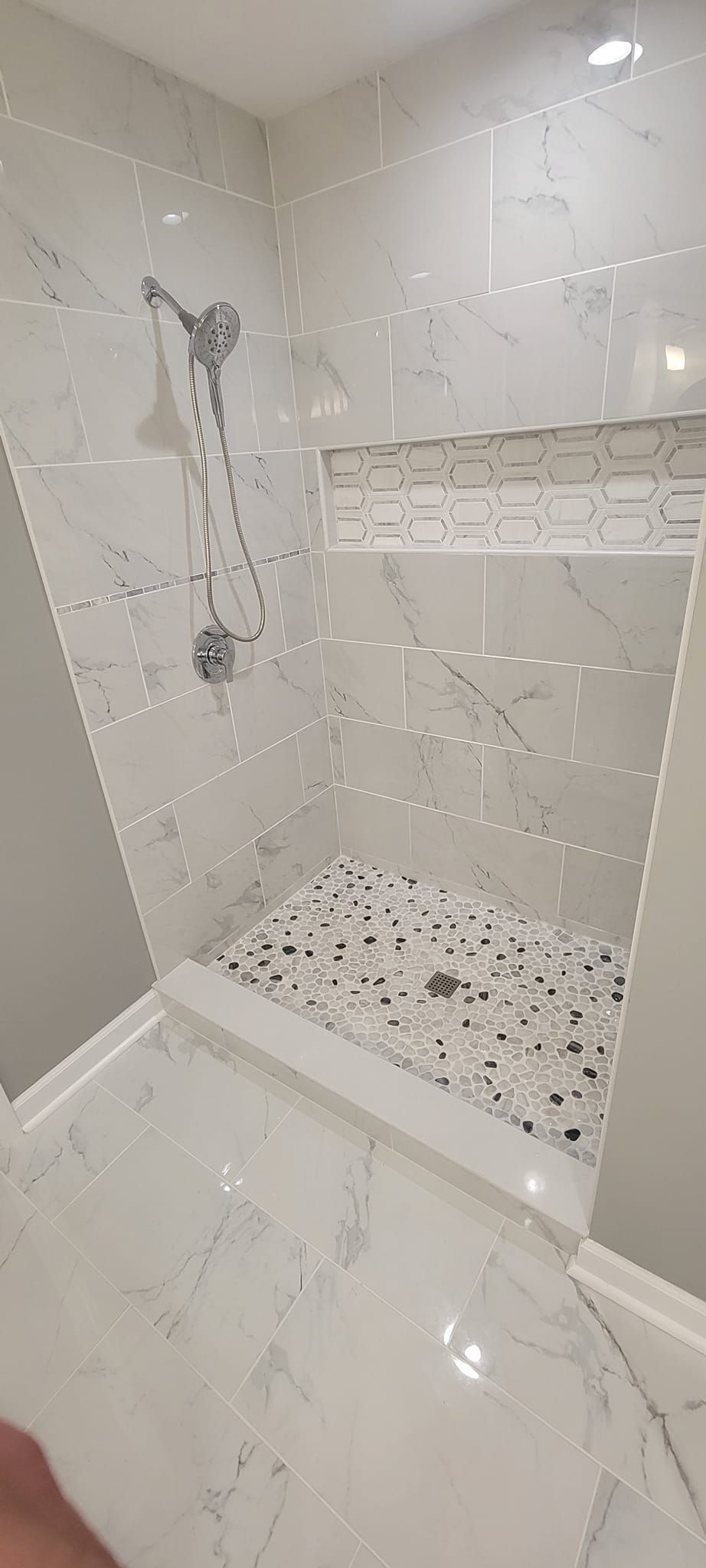 A bathroom with a walk in shower and a bathtub.