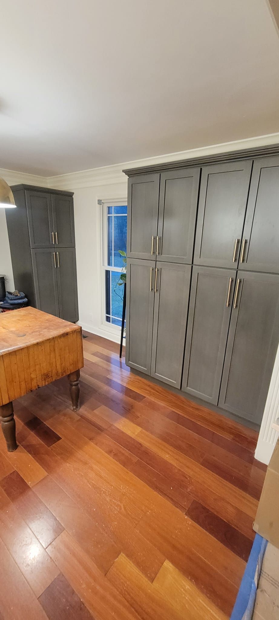 There is a pool table in the middle of the room.