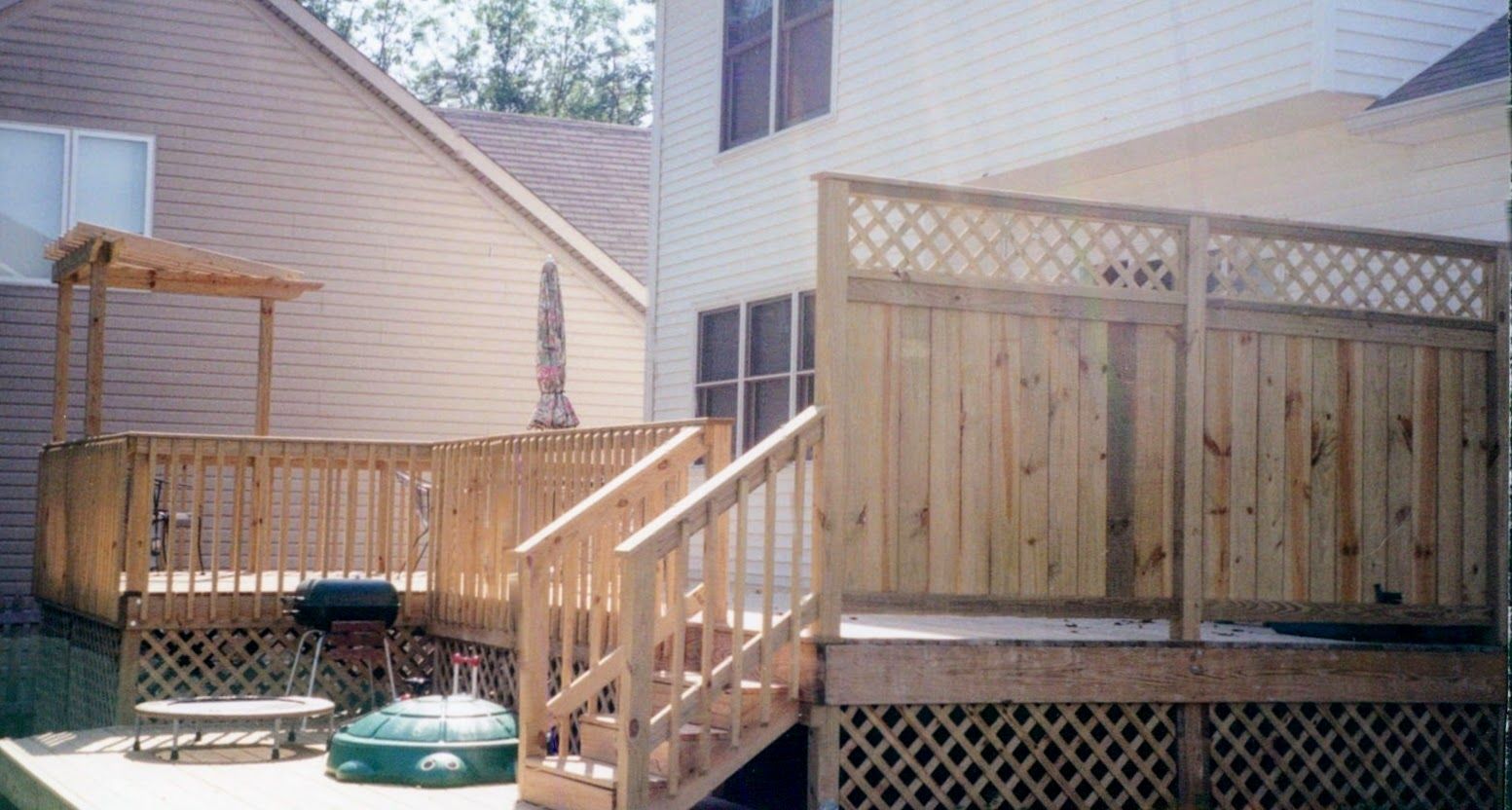 A wooden deck with stairs leading up to it