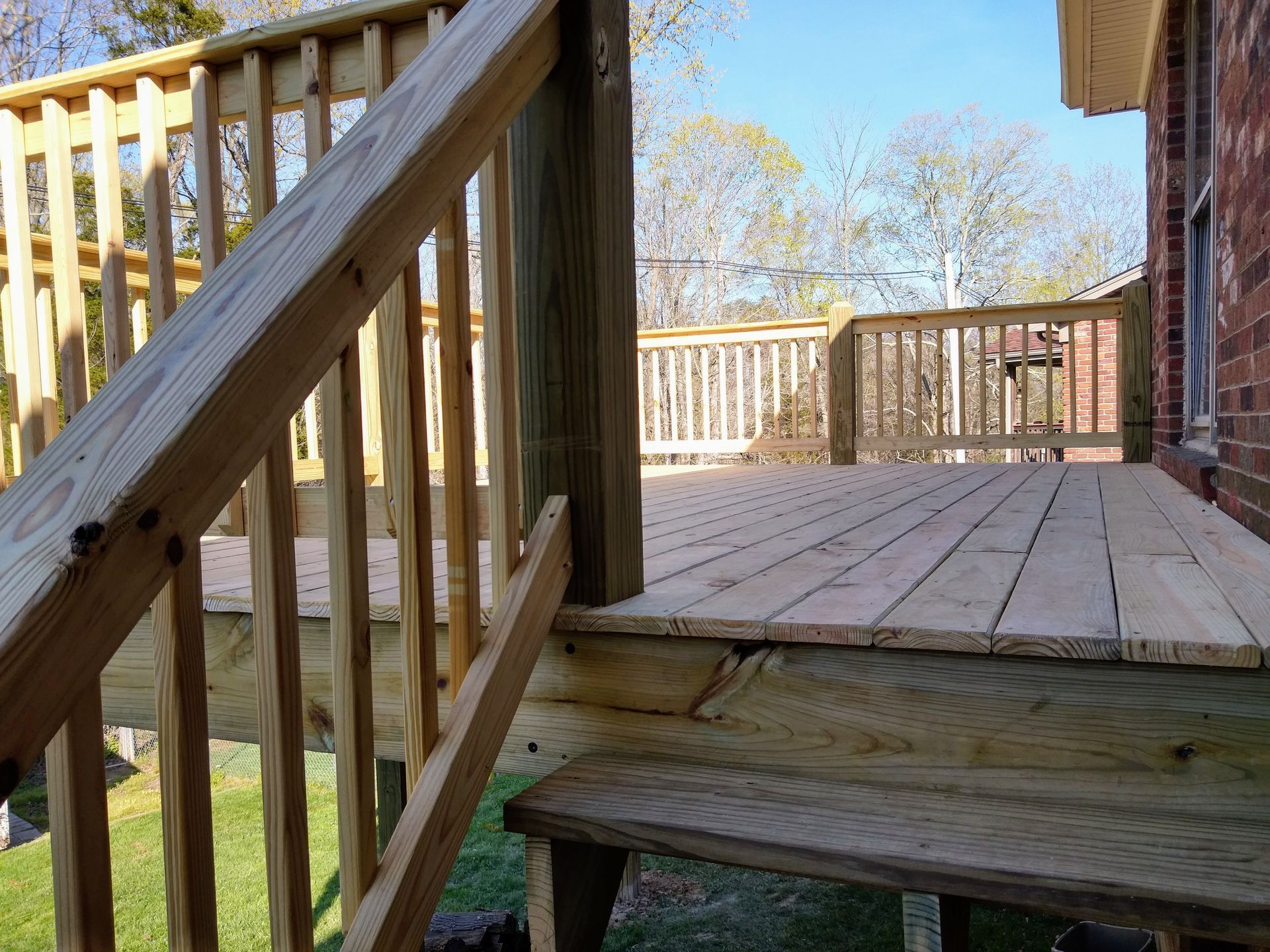 A wooden deck with stairs leading up to it