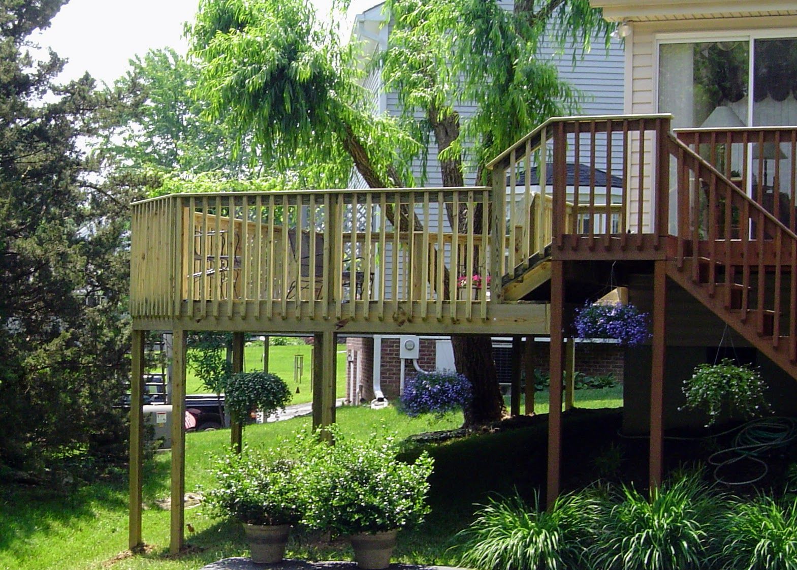 A wooden deck with stairs leading up to it