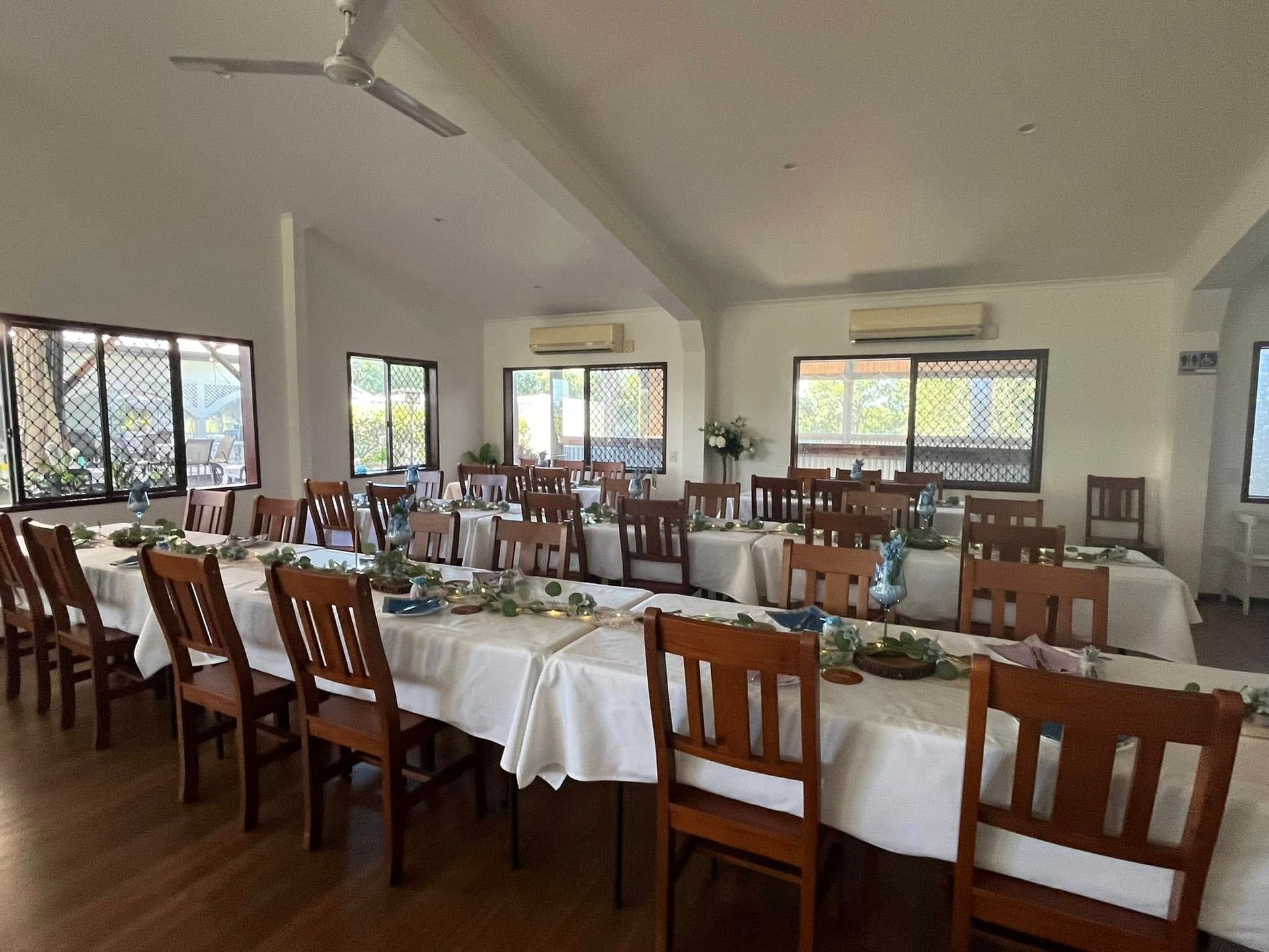 Dining Room Set for a Meal. Tables Are Arranged With Place Settings — Villa Lamor in Balberra, QLD