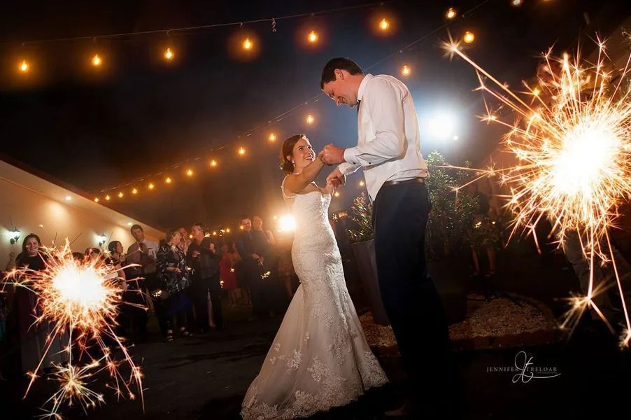 Bride and Groom Dance Under String Lights With Sparklers at Wedding Reception — Villa Lamor in Balberra, QLD