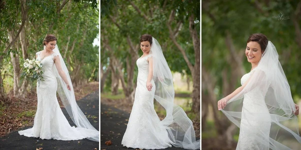 Bride in White Wedding Dress and Veil Stands in Tree-lined Pathway — Villa Lamor in Balberra, QLD