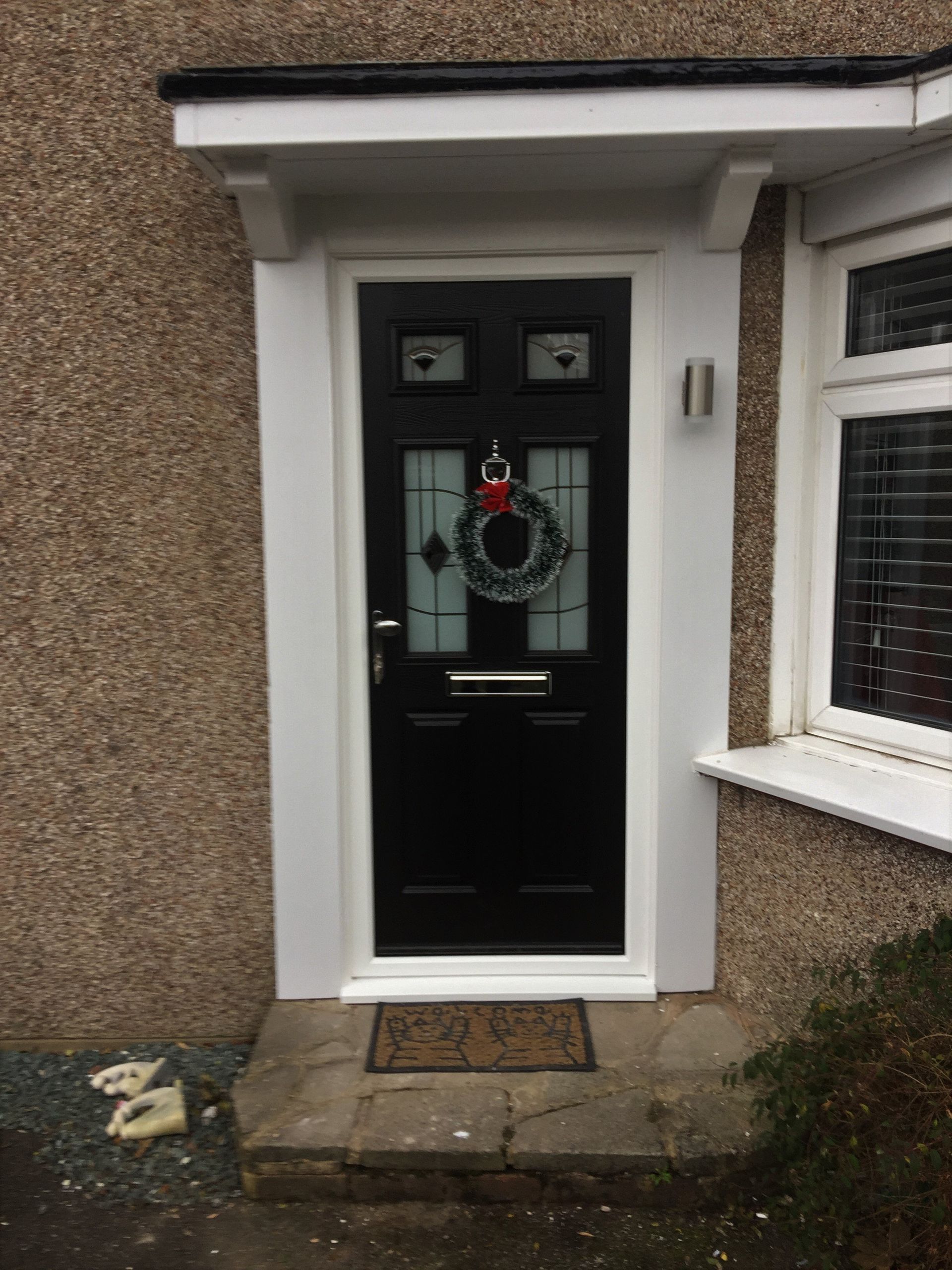 composite door in dark blue with christmas wreath
