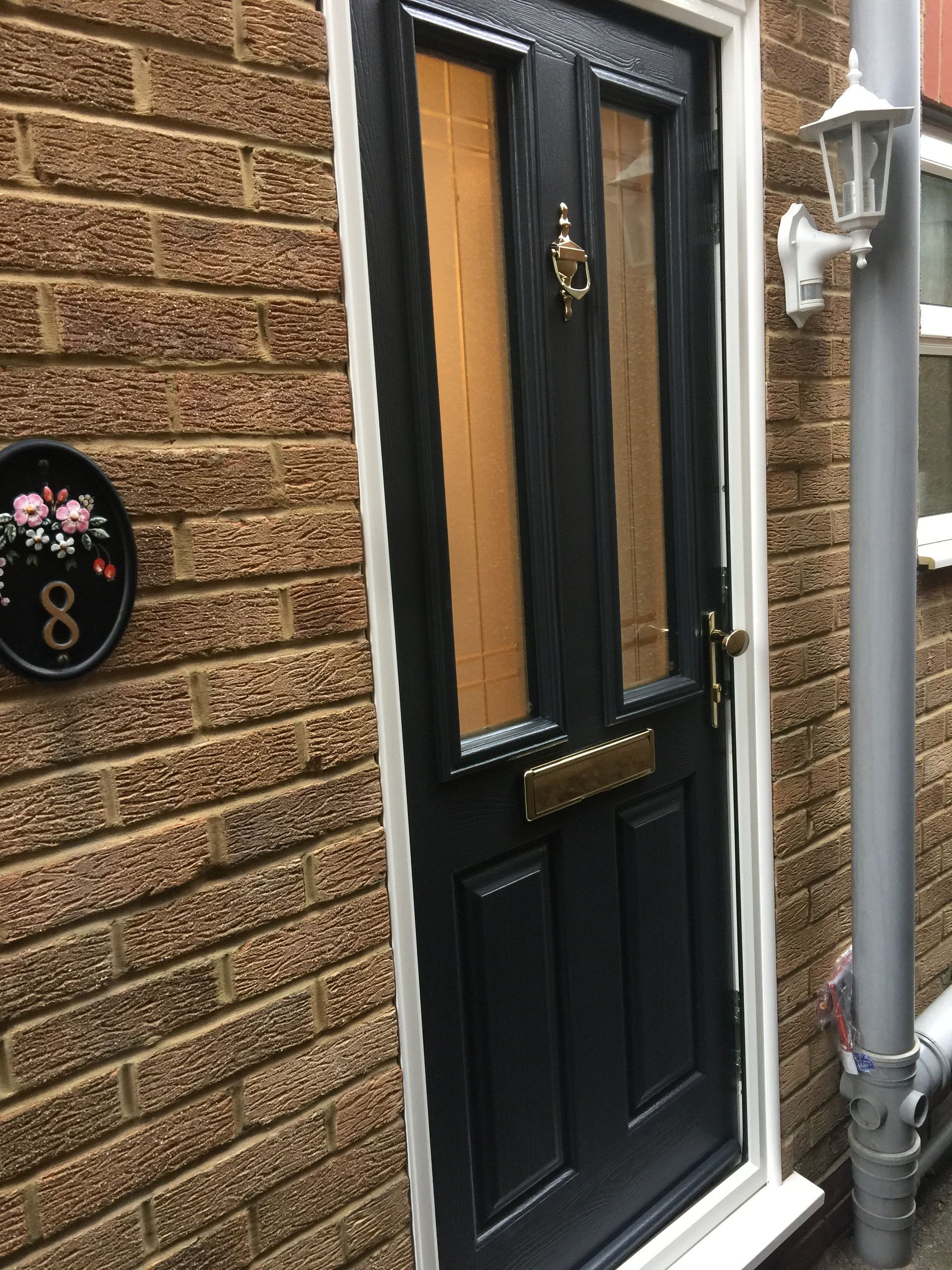 composite door in dark blue with light on