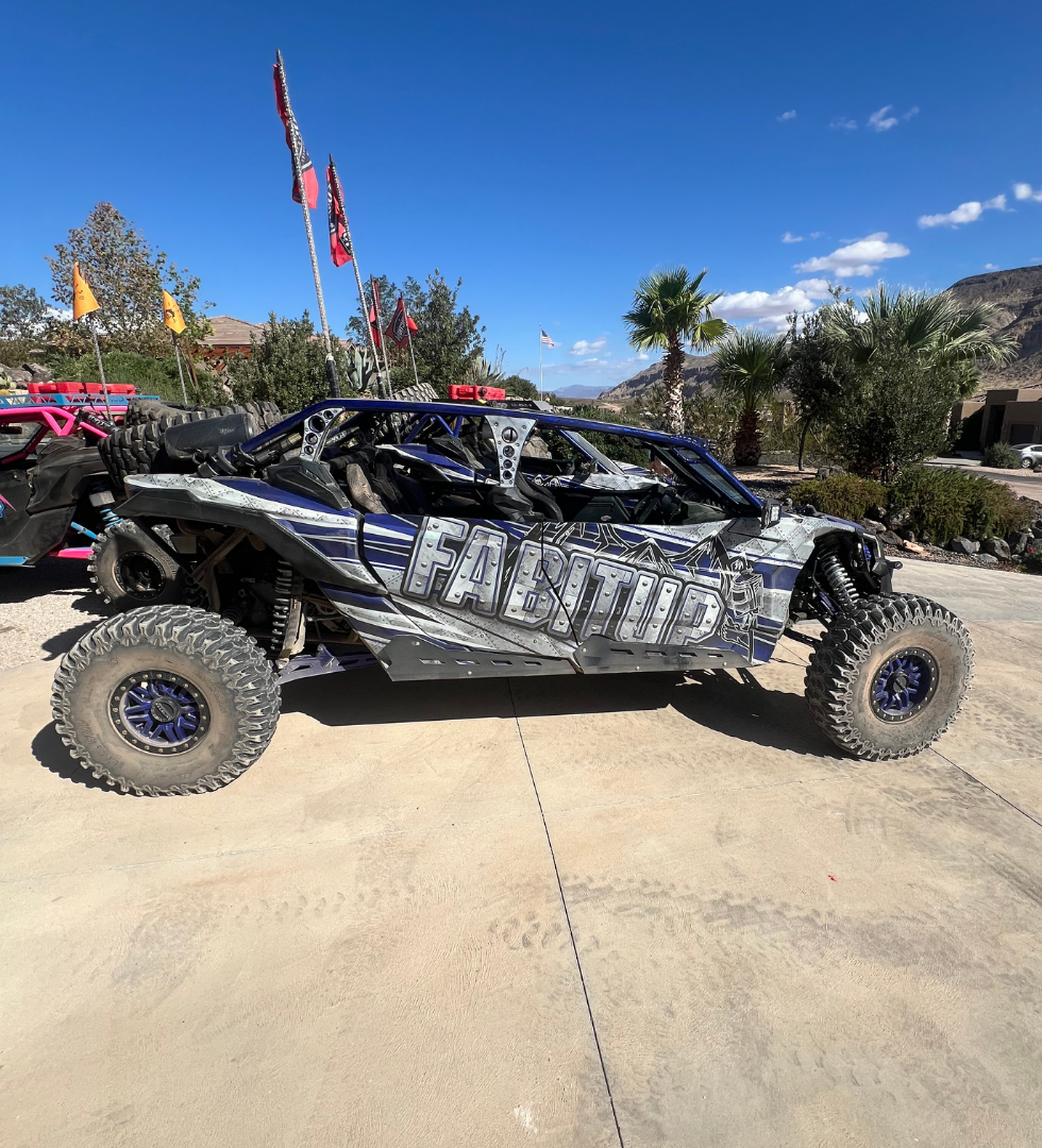 A can am maverick x3 is parked in a parking lot.
