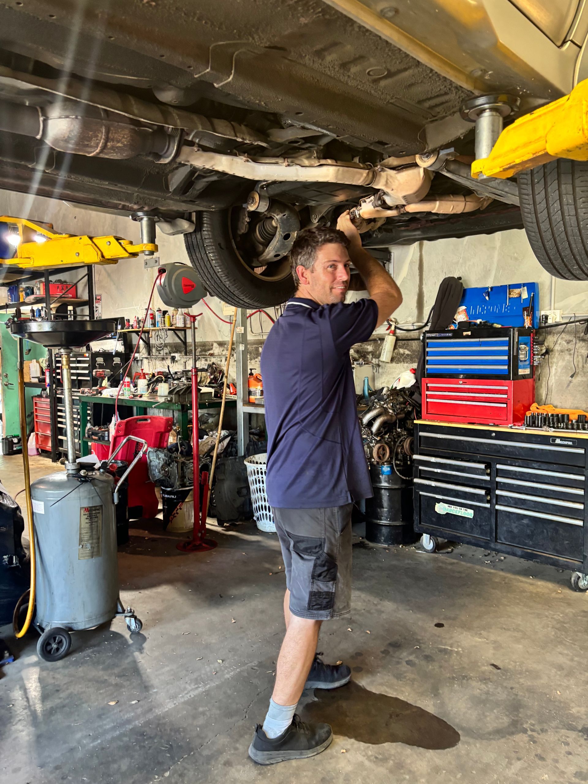 A Black Subaru Hatchback Is Parked On A Gray Background — Subi Care Mechanical In South Murwillumbah, NSW