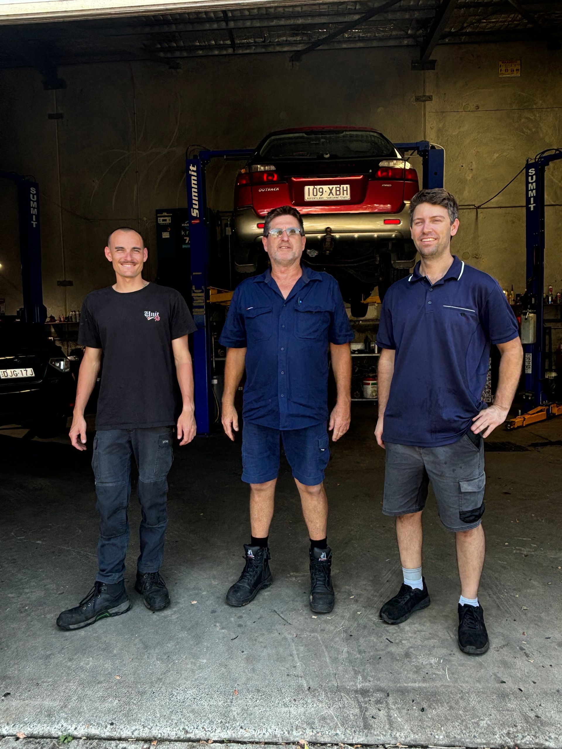 A Car Is Sitting On A Lift In A Garage — Subi Care Mechanical In South Murwillumbah, NSW