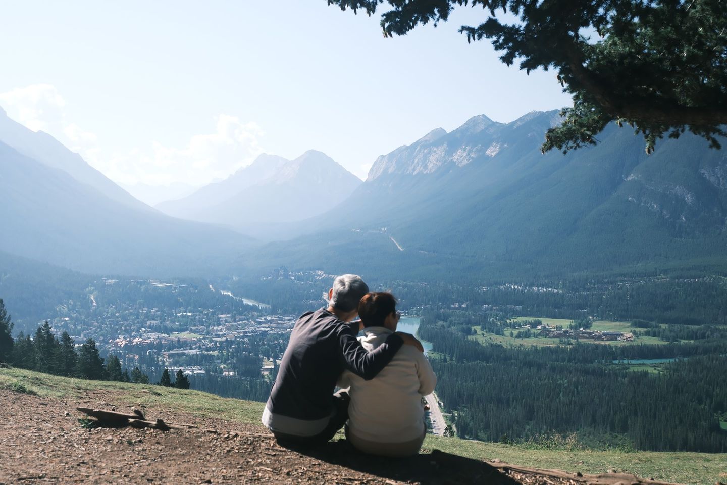 Couple overlooking Banff townsite and Bow Valley from Mount Norquay, Banff Bear Travel small group tour photography