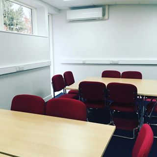 air conditioning unit on the wall of a classroom