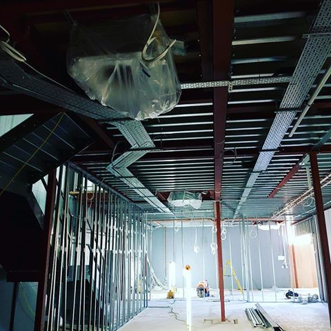 wrapped up air conditioning on the ceiling of an open space