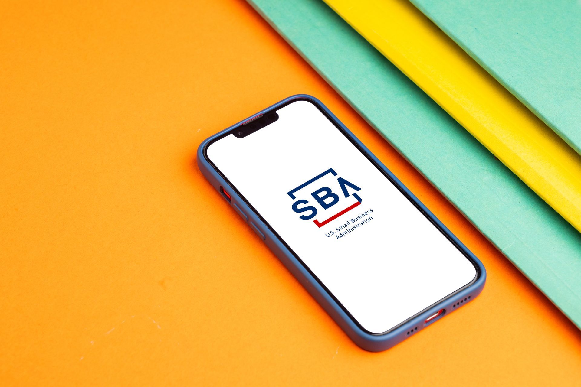 Phone with SBA on the screen with colorful background 