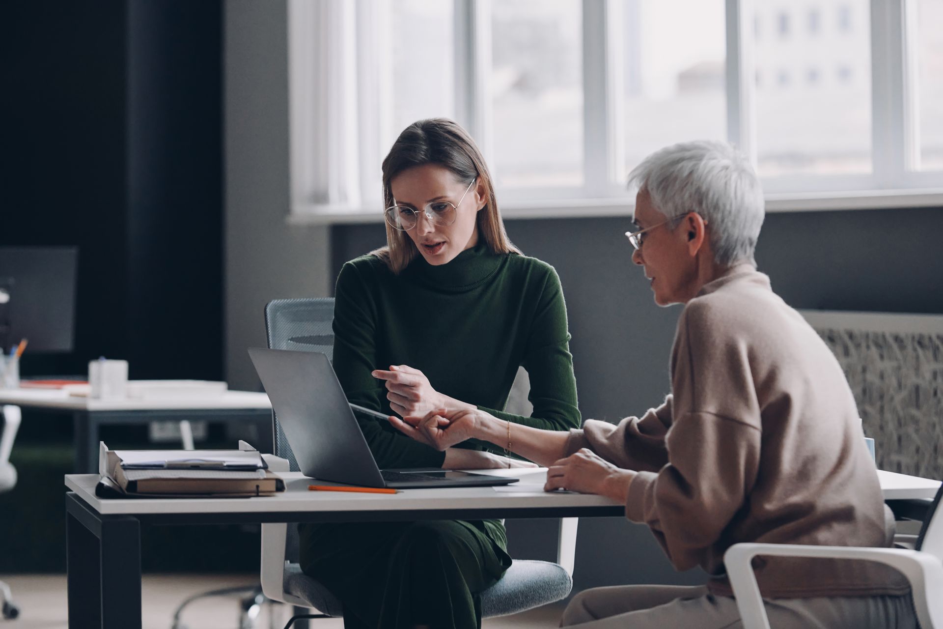 Woman consulting older woman