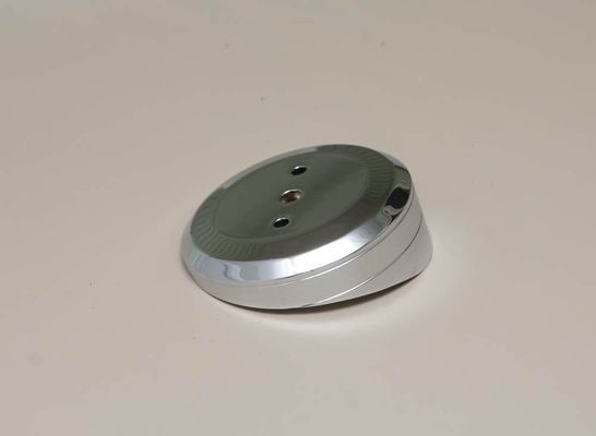 Chrome-plated, angled base with three holes, on a neutral background.