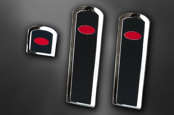Chrome trim set with black textured inserts and red oval accents.