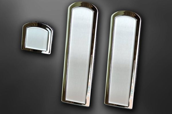 Three chrome-edged vehicle trim pieces. Two long rectangles and one smaller square, all with a silver interior.