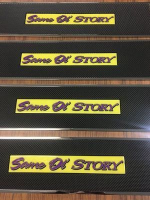 Four black carbon fiber strips with