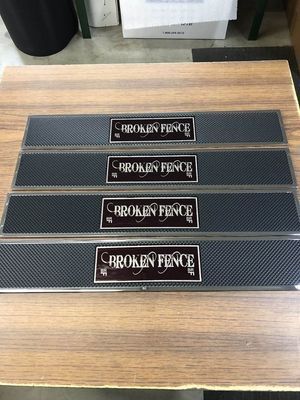 Four rectangular bar mats with
