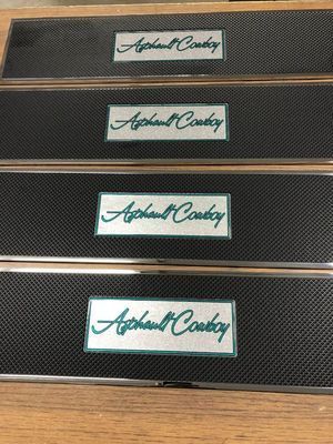 Four black step plates with the words