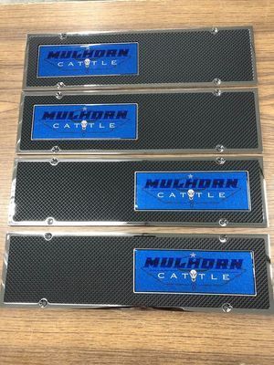 Four license plate frames with