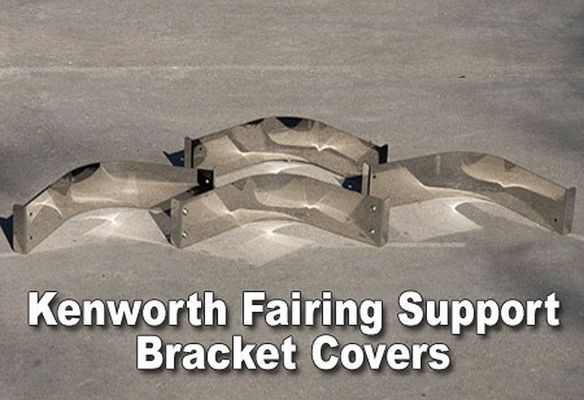 Four Kenworth fairing support bracket covers, gray, on a concrete surface.