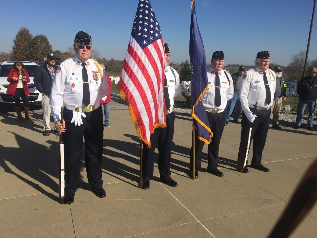 a sunset over a mountain range with a cloudy sky