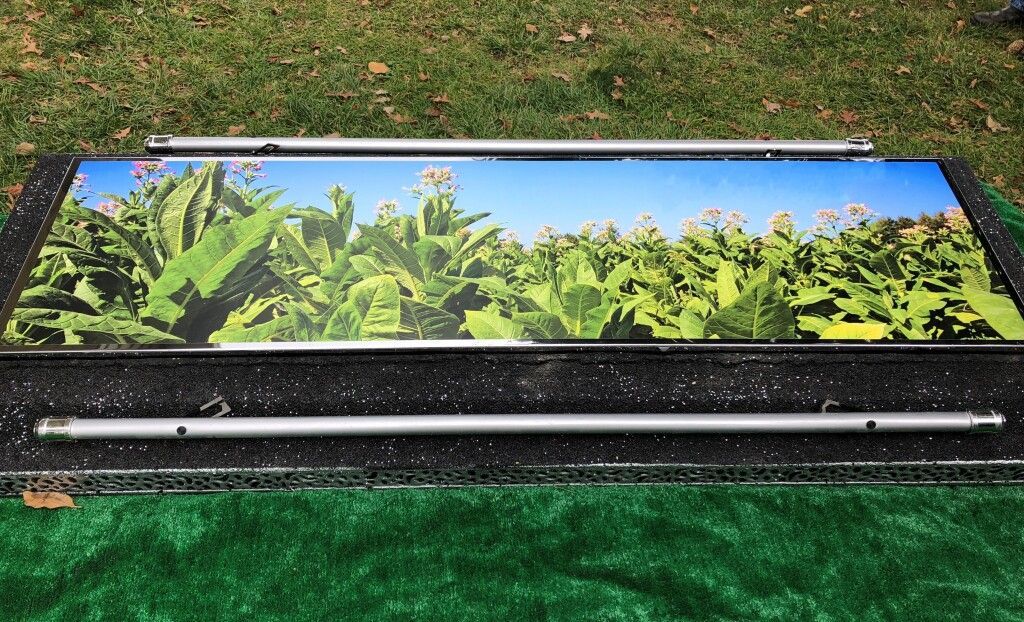 A picture of a field of plants is sitting on the ground.