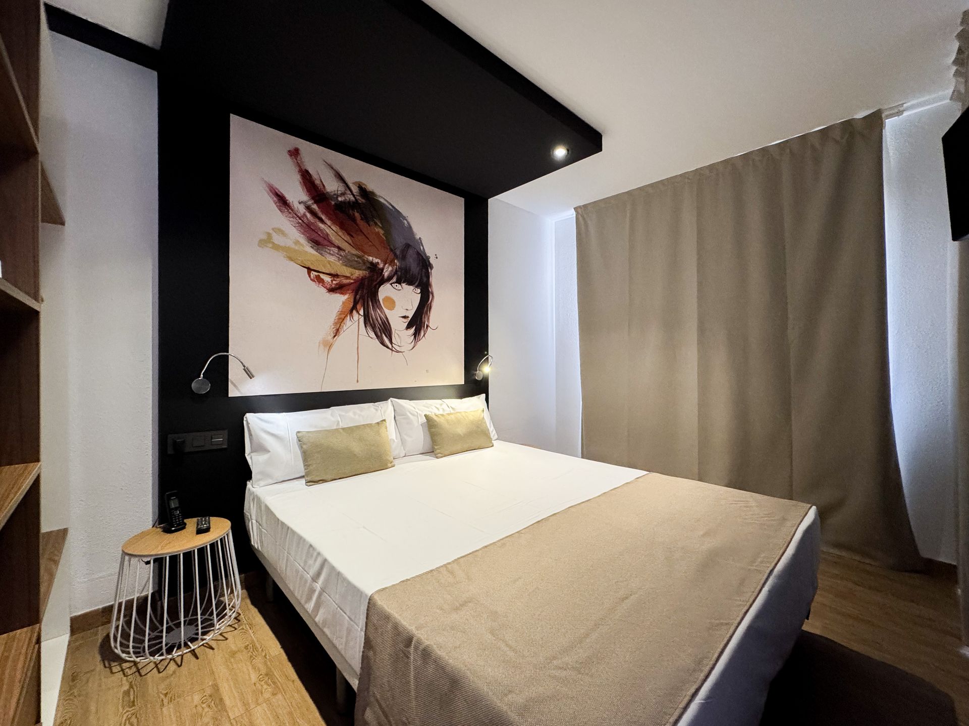 A hotel room with two beds and a red counter