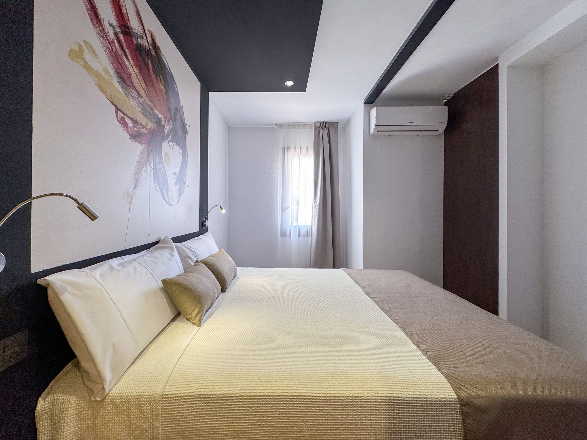 A hotel room with two beds and a red counter