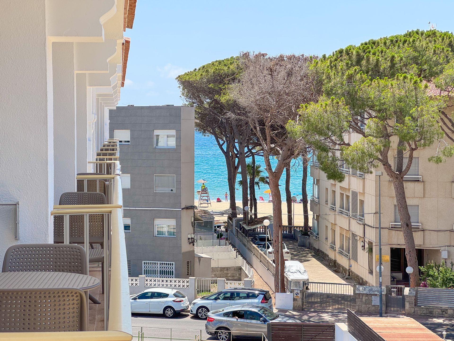 A hotel lobby with a marble counter and a clock on the wall.