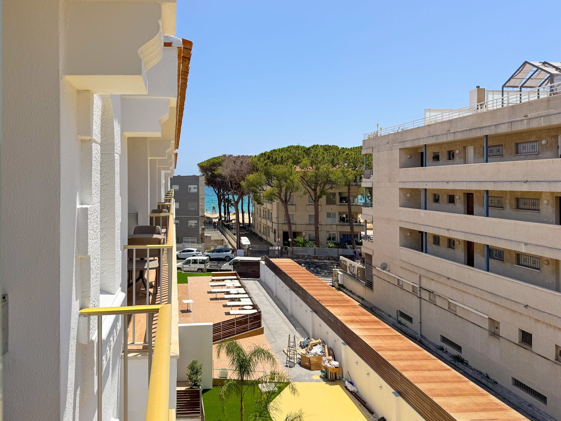 A bathroom with a walk in shower , sink and mirror.