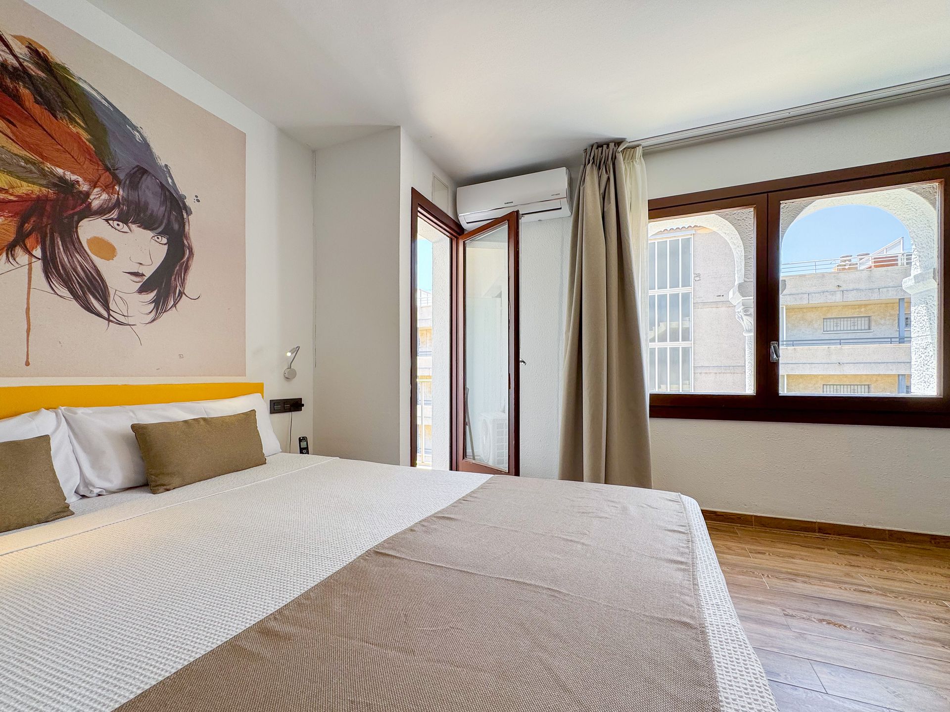 A bathroom with a walk in shower , sink and mirror.